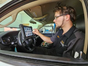 A Mechanic from GMK Mechanical doing engine diagnostics in Honey Brook, PA