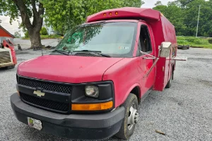 A red truck receiving mobile repairs by GMK Mechanical in Lititz, PA